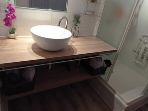 Shower, hair dryer, towels, soap