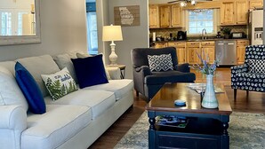 A living room with a white sofa, a coffee table, and a ceiling fan. - Etowah River, Berry & Shorter College, Tennis, Trails-3 miles from Broad St. (Rome)