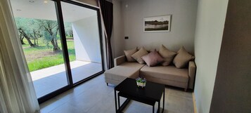 Deluxe Suite, Lake View | Living area | Smart TV