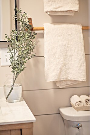 Bathtub, hair dryer, towels, soap