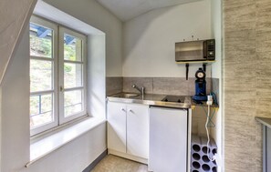 Fridge, microwave, stovetop, coffee/tea maker