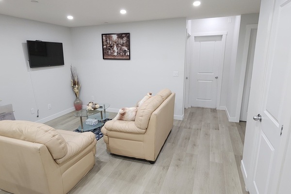 Living room space with dimmer lights for movies and a moveable workstation