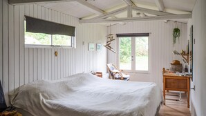 A bedroom with a bed, a chair, a desk, and a window. - 3 bedroom awesome home in Anholt (Anholt)