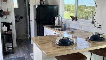 Fridge, microwave, stovetop, coffee/tea maker