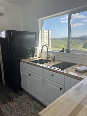 Fridge, microwave, stovetop, coffee/tea maker