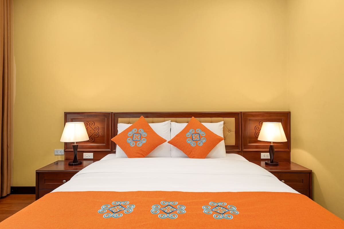 Habitación superior con 1 cama matrimonial o 2 individuales, vista al jardín | Ropa de cama hipoalergénica y minibar
