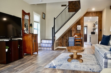 Cozy up in the living room and stream your favorite show on the big screen TV.