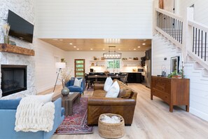 Smart TV, fireplace, foosball, books