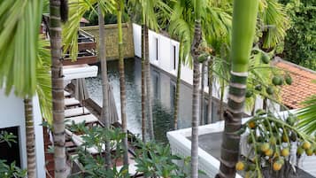 Outdoor pool, open 9:00 AM to 9:00 PM, pool umbrellas, pool loungers