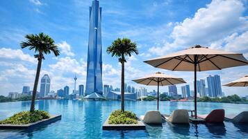 2 outdoor pools, open 8:00 AM to 10:00 PM, pool umbrellas