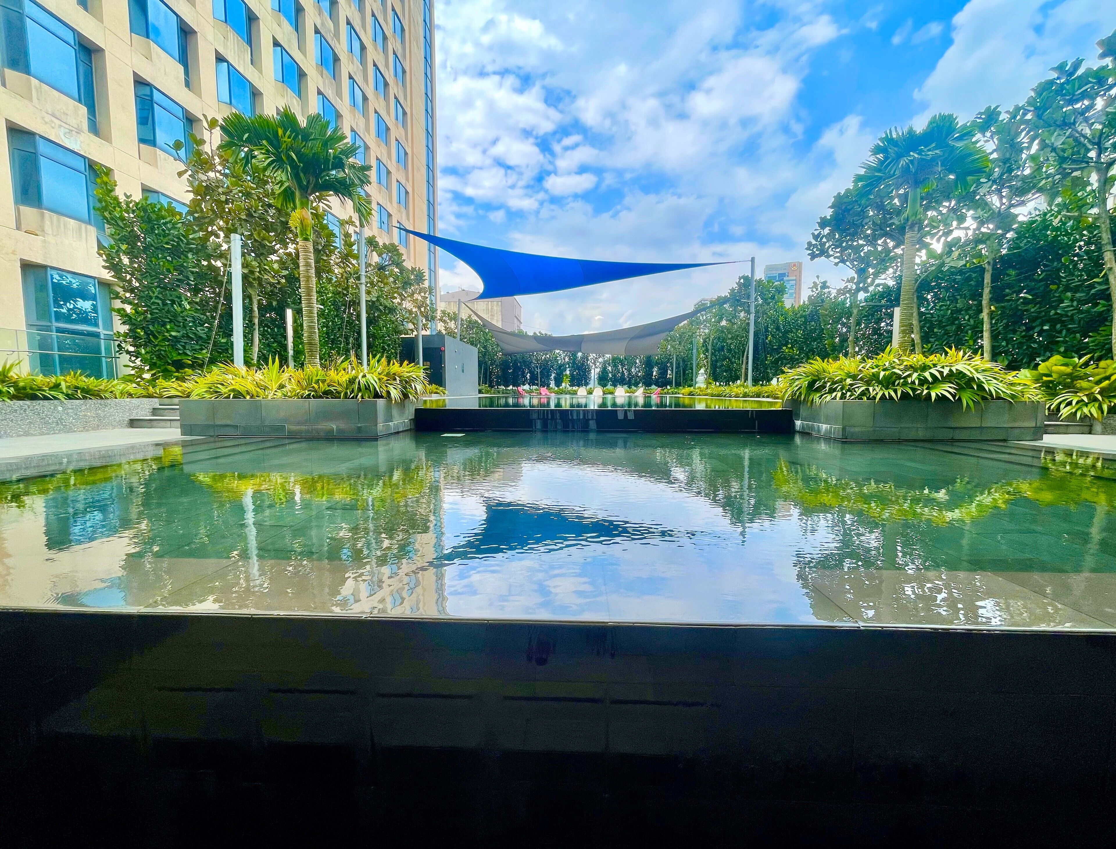 2 outdoor pools, open 8:00 AM to 10:00 PM, pool umbrellas