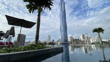 2 outdoor pools, open 8:00 AM to 10:00 PM, pool umbrellas