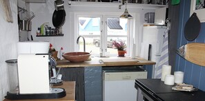 Fridge, stovetop, dishwasher, coffee/tea maker