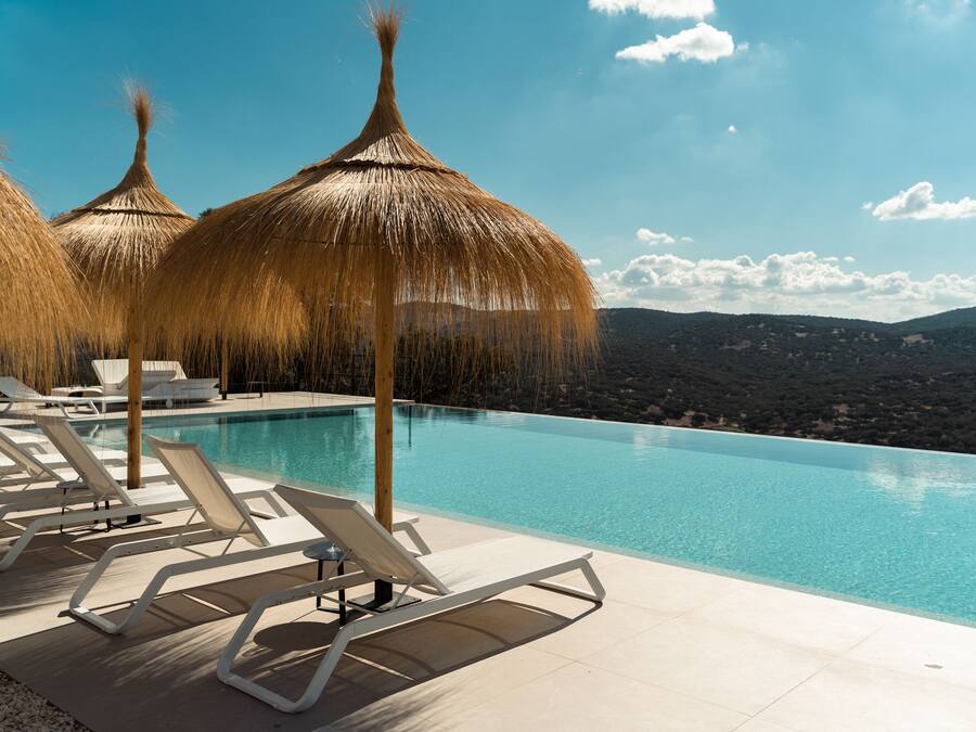 Outdoor pool, open 9:00 AM to 9:00 PM, pool umbrellas, pool loungers