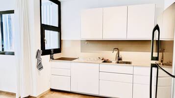 Comfort Apartment | Private kitchen | Full-size fridge, microwave, oven, stovetop