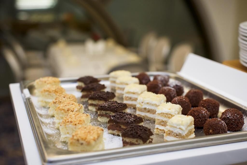 A display case with various desserts.
