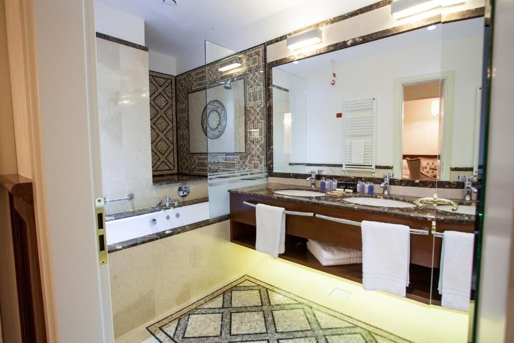 luxury suite | bathroom | shower, bathrobes, slippers, towels