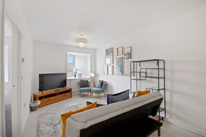 Deluxe Suite | Living area | 43-inch TV with cable channels, Netflix, streaming services - Theodora Suites by Kasar Stays (Maidstone)