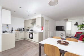 Executive Suite | Living area | 43-inch TV with cable channels, Netflix, streaming services - Theodora Suites by Kasar Stays (Maidstone)