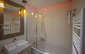 Bathtub, hair dryer, towels, soap