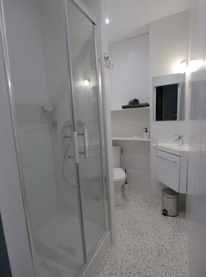 Shower, hair dryer, towels, soap