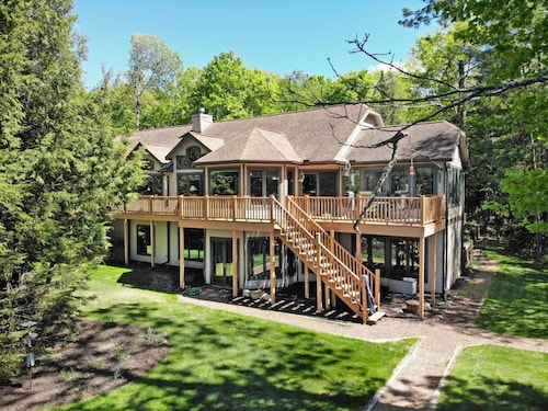 Private waterfront lake, sand beach, bar that seats 12, game room,