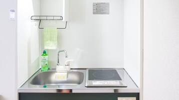 Fridge, microwave, coffee/tea maker, cookware/dishes/utensils