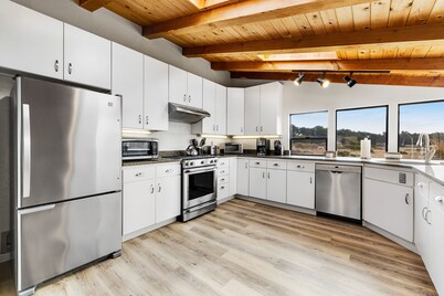 Dog-friendly home with private hot tub, ocean/meadow views & shared pools