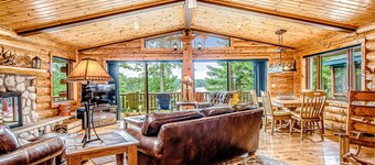 Lakefront log cabin on 3.5 acres with dock, gazebo & sunset views - dog-friendly