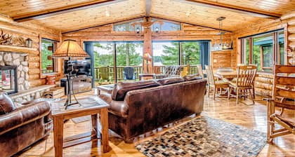 Lakefront log cabin on 3.5 acres with dock, gazebo & sunset views - dog-friendly