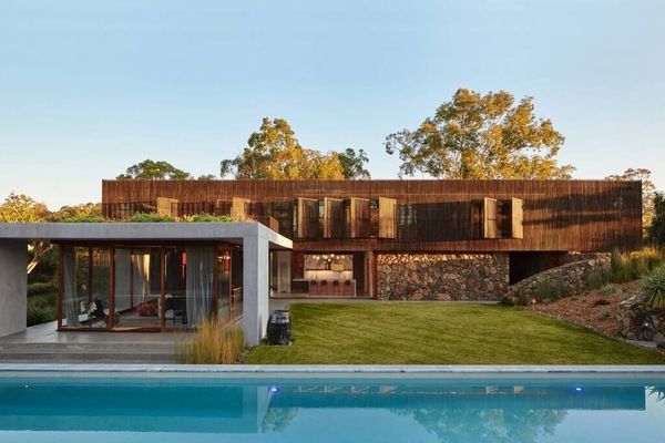 To the left (grey) is the main living area, overlooking a 25-metre pool.