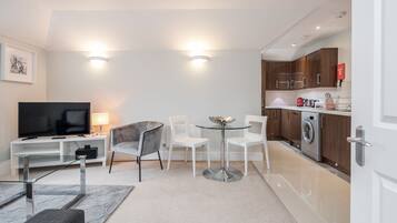 Standard Double Room | Living area | 40-inch Smart TV with digital channels, TV