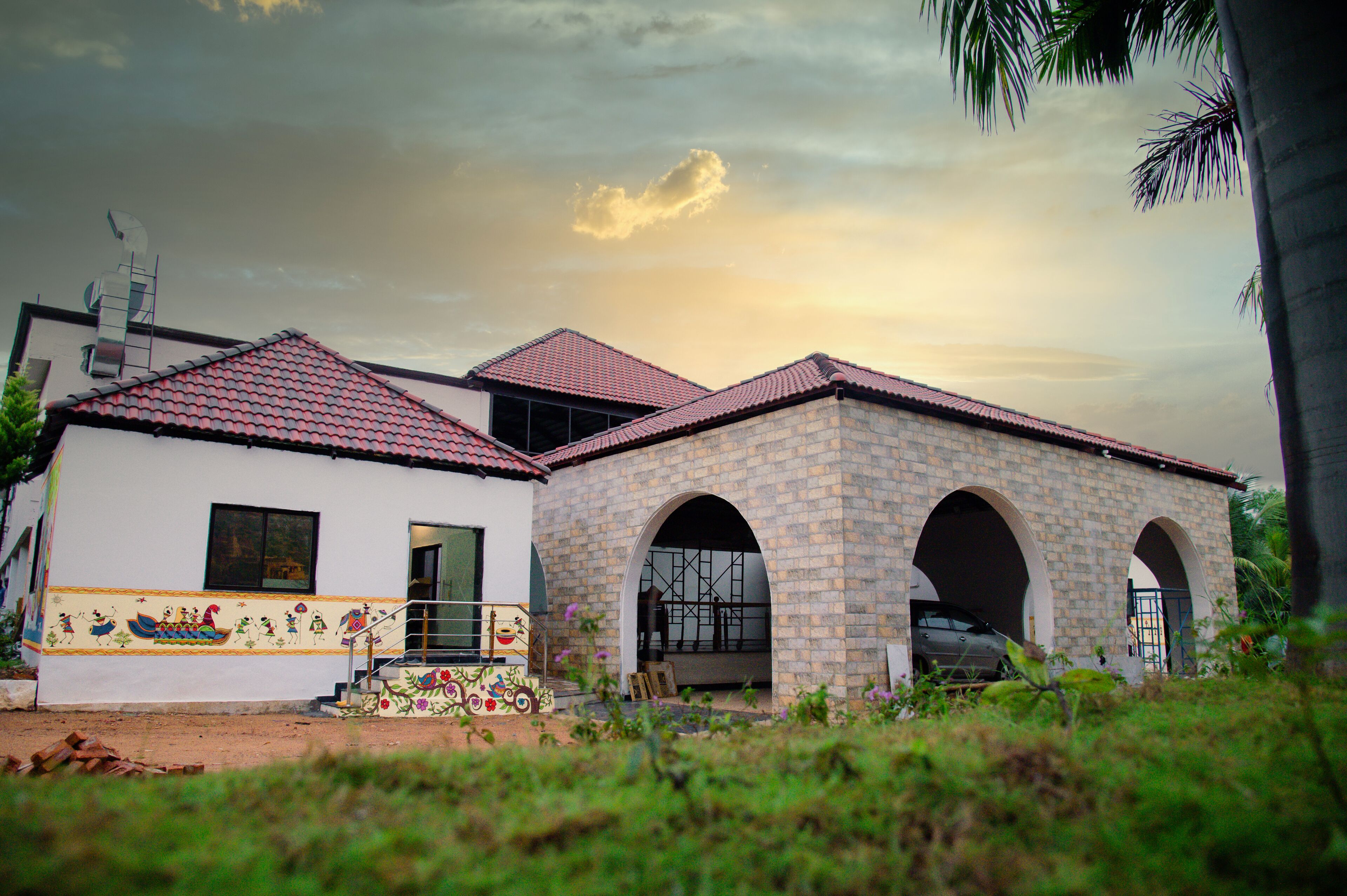 A two-story building with a tiled roof and a brick facade.
