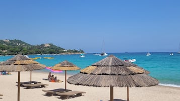 On the beach, sun-loungers