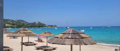 On the beach, sun loungers