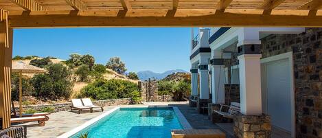 Outdoor pool, a heated pool, sun loungers