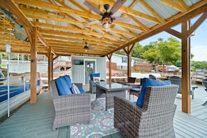 Relax on the covered deck with a glass-top table and two comfortable chairs.