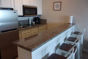 Fridge, microwave, oven, stovetop - Sassy Seahorse - FRONT ROW - Beach Views 8 Guests (Galveston)