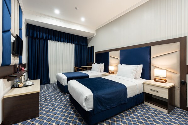 Premium bedding, down comforters, in-room safe, desk
