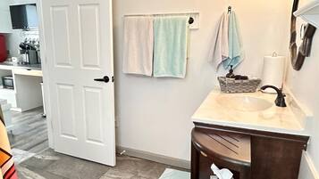 Fridge, microwave, coffee/tea maker, cookware/dishes/utensils