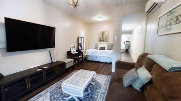 1 bedroom, desk, iron/ironing board, travel crib