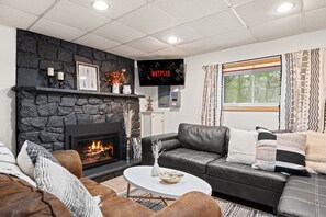 Smart TV, fireplace, foosball, books