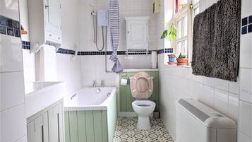 Combined shower/bathtub, hair dryer, towels, soap