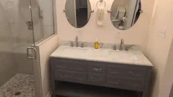 Shower, hair dryer, towels, toilet paper
