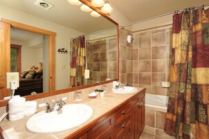 Townhome, 2 Bedrooms | Bathroom | Combined shower/tub, free toiletries, hair dryer, towels