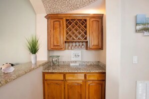 Enjoy cooking in this well-equipped kitchen with a wine rack and ample counter space.