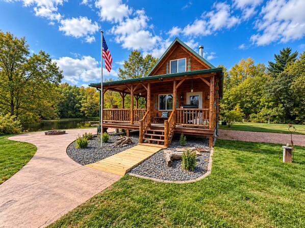 Unclassified image, 1 of 32, button - Relax at The Lincoln Log Cabin perched along the Jump River. (Sheldon)