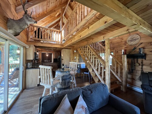 Relax at The Lincoln Log Cabin perched along the Jump River.