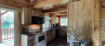 Relax at The Lincoln Log Cabin perched along the Jump River.