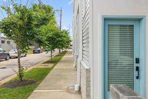 Houses with consistent architectural style line the quiet residential street.